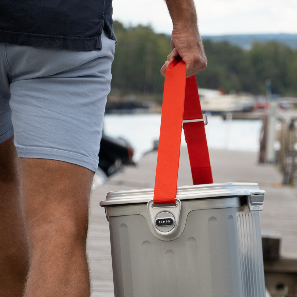 man holding cooler box with strap